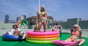 Adorable Japanese girl models a string bikini by a swimming pool